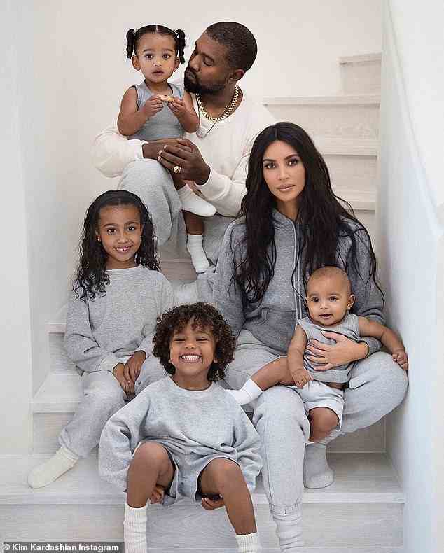 Family: Kanye is pictured with his estranged wife Kim Kardashian and their children North, nine, Chicago, four, Saint, six, and Psalm, three