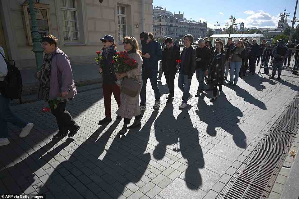 People stand in line to attend a farewell ceremony in front of the building of the Hall of Columns, where a farewell ceremony for the last leader of the Soviet Union and recipient of the Nobel Peace Prize in 1990, Mikhail Gorbachev is taking place