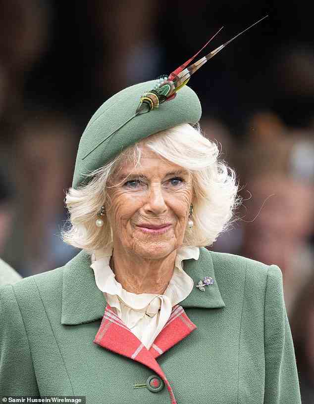 Camilla finished her look with a natural make-up look, pairing a fresh base with a natural pink lip. Under her green hat, her locks were styled into loose waves