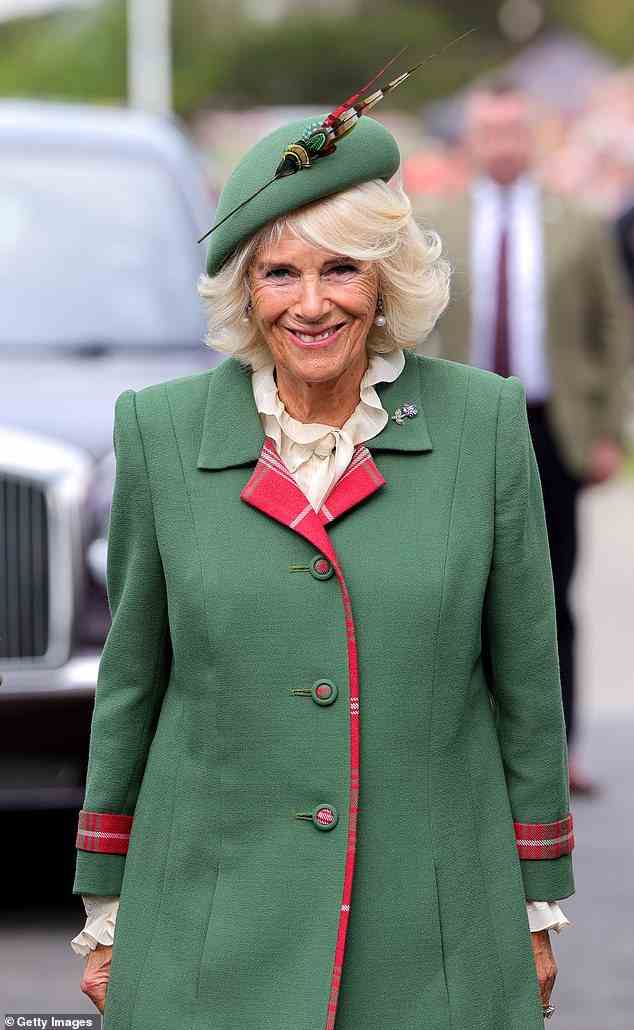 Camilla's green outfit gave a nod to Scotland, with its red tartan trim, and matching button detail