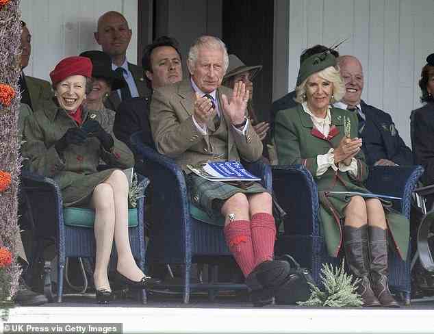 The royals took to their seats to watch the traditional demonstrations during the Braemar Highland Gathering today (pictured L-R: Princess Anne, Prince Charles, and the Duchess of Cornwall)
