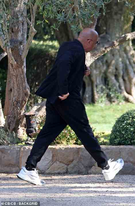 Almost on time: Vin Diesel was pictured running into the venue as he arrived late for the wedding, missing part of the ceremony