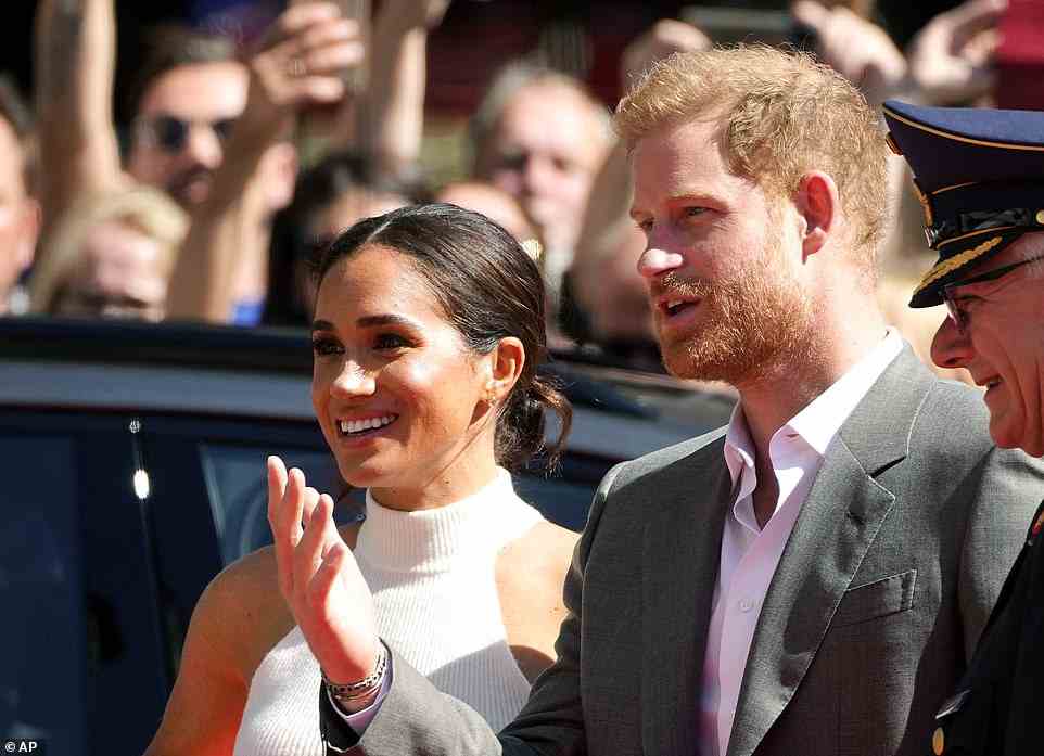 Meghan, who wore simple stud earrings, opted for subtle eyeliner and a little blusher to enhance her natural looks as she smiled alongside her husband