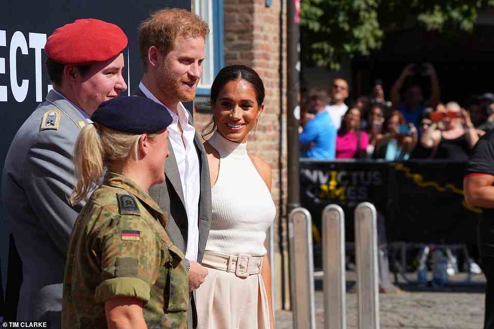 Meghan perfectly paired her cream knitted top from LA-based designer Anine Bing with the belted wide-leg trousers from Brandon Maxwell