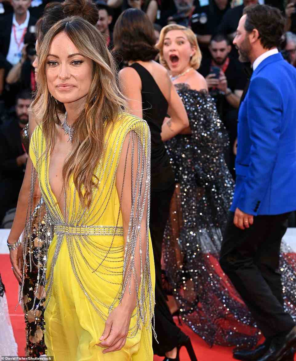 There were hugs for everyone else from Florence – and plenty of kisses and selfies with fans. But as far as Styles and Wilde were concerned, they may as well have been on a different planet. Consummate actress that she is, Pugh (right animatedly chatting with her co-stars while Olivia Wilde looks the other way) managed to look thrilled to be there