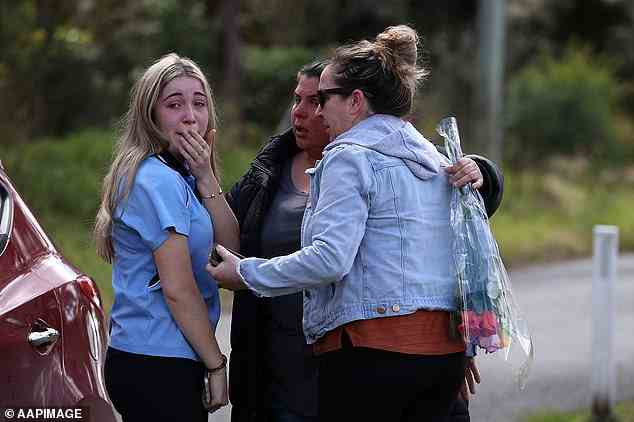 Some distraught students were accompanied by parents as they visited the scene of the crash