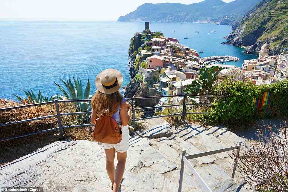 Walking is the most wonderful way to see the Cinque Terre as the coastal trails offer the most spectacular views of the teal-blue sea below (stock image)