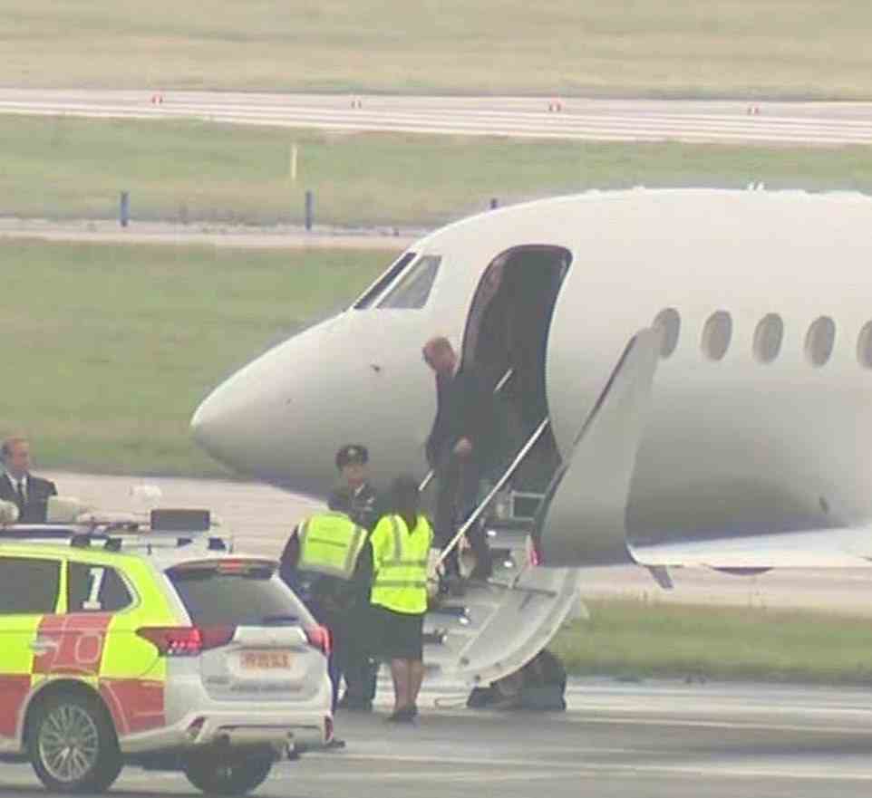 Prince William gets off the plane in Aberdeen today as members of the Royal Family gather at Balmoral after a warning from the Queen's doctors about her health
