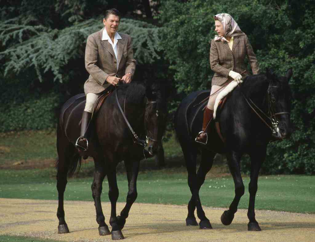 British Royalty. Windsor, England. June 1982. Queen Elizabeth II rides on horseback with American President Ronald Reagan.