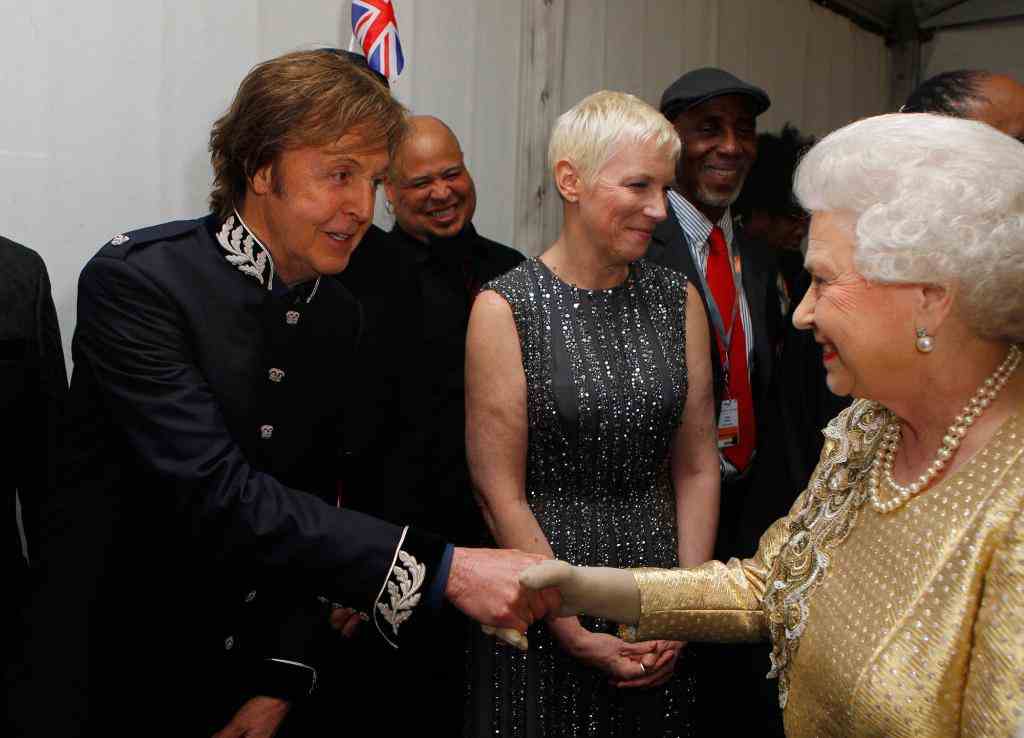 Britain's Queen Elizabeth II (R) meets S