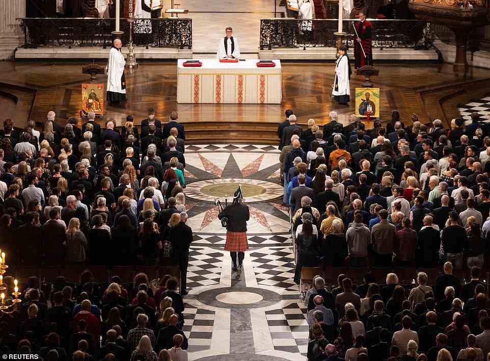 A lone piper plays a lament during the Service of Prayer and Reflection at St Paul's Cathedral