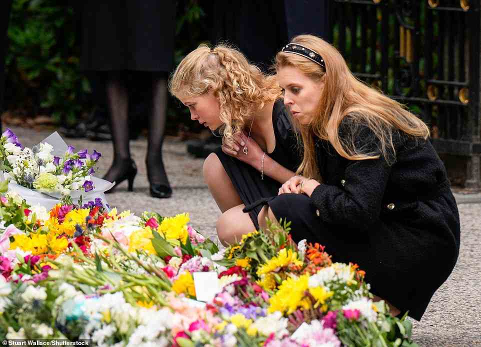 Tributes: members of the royal family, among the Lady Louise Windsor (left) and Princess Eugenie (right) spent some 10-minutes looking at flowers left by the public
