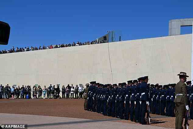 The Federation Guard outside Parliament House while crowds formed in the distance on Sunday