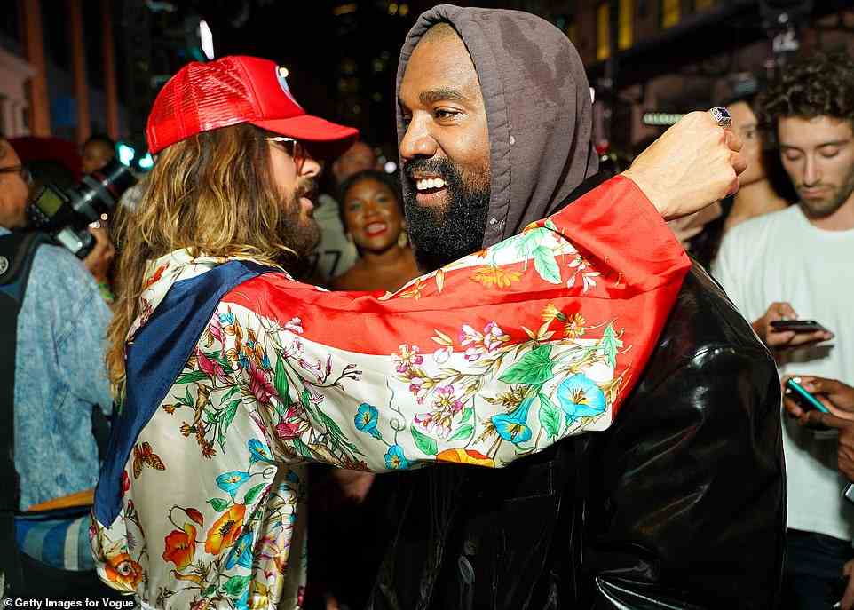 Doing his own thing: On the other side of town, Fox's ex-boyfriend Kanye West was captured schmoozing with actor Jared Leto at the star-studded VOGUE World show
