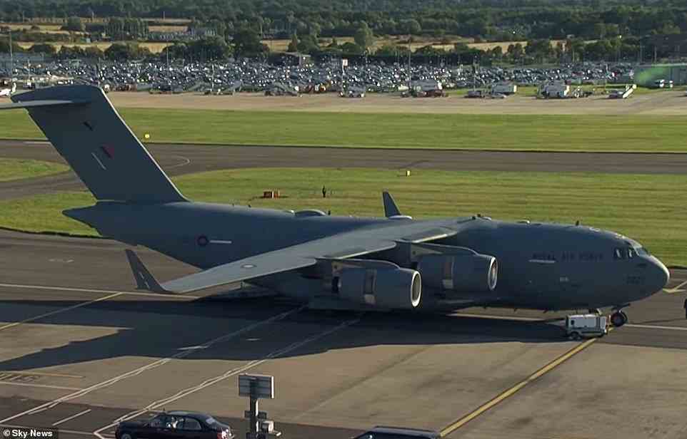 An RAF Globemaster C-17 jet sitting on the runway at Edinburgh Airport