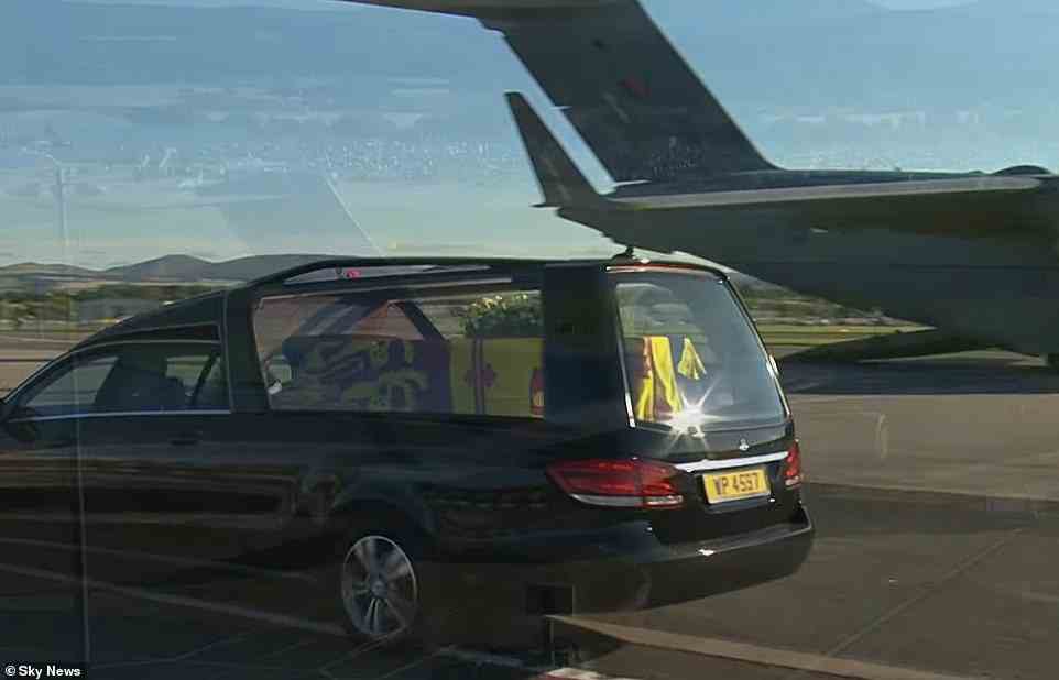 The Queen's coffin being driven to Edinburgh Airport, where an RAF plane is sitting on the runway