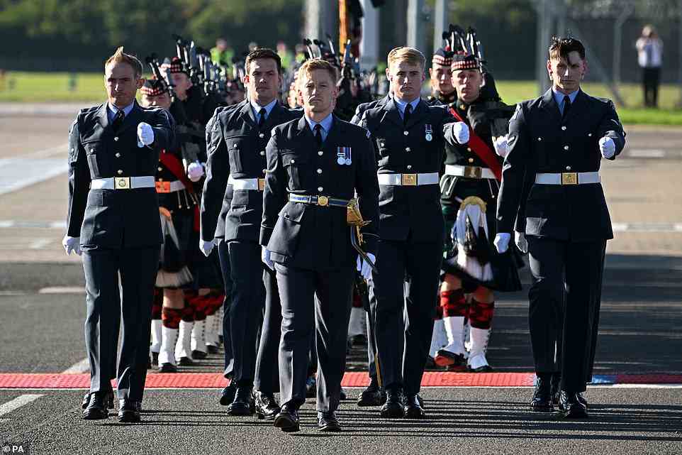 A Royal Air Force bearer party prepare for the arrival of the coffin of Queen Elizabeth II at Edinburgh Airport
