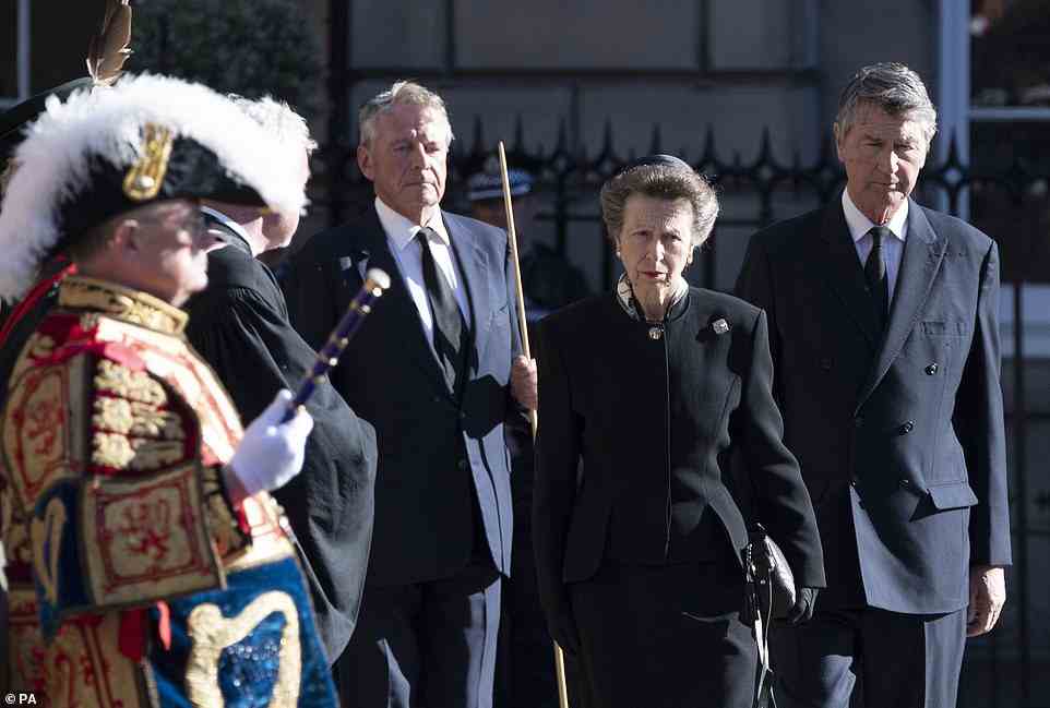 The Princess Royal and Vice Admiral Timothy Laurence after the coffin of Queen Elizabeth II is taken to a hearse as it departs St Giles' Cathedral, for Edinburgh Airport