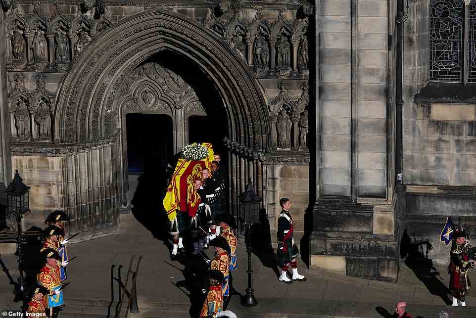 Pallbearers carry the coffin of Elizabeth II from St Giles' Cathedral before it travels to Edinburgh Airport