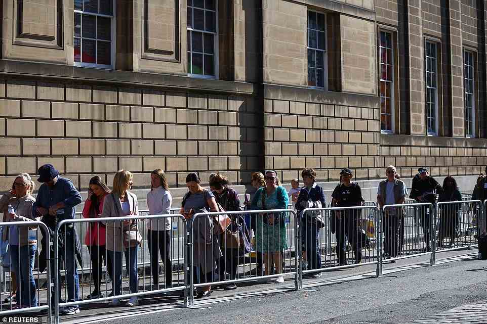 People queue to enter St Giles' Cathedral, following the death of Queen Elizabeth, in Edinburgh