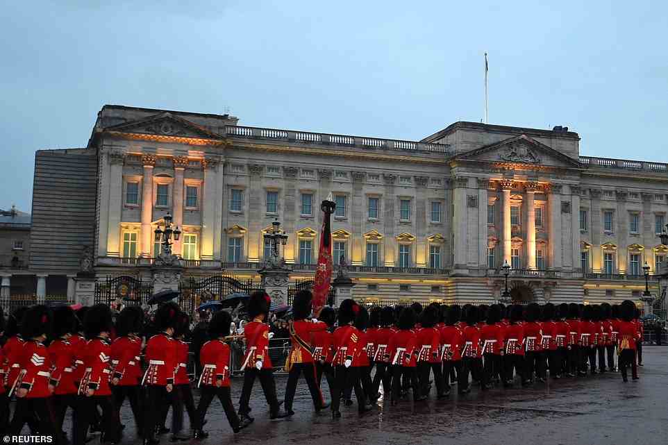 Members of The Household Division march outside Buckingham Palace