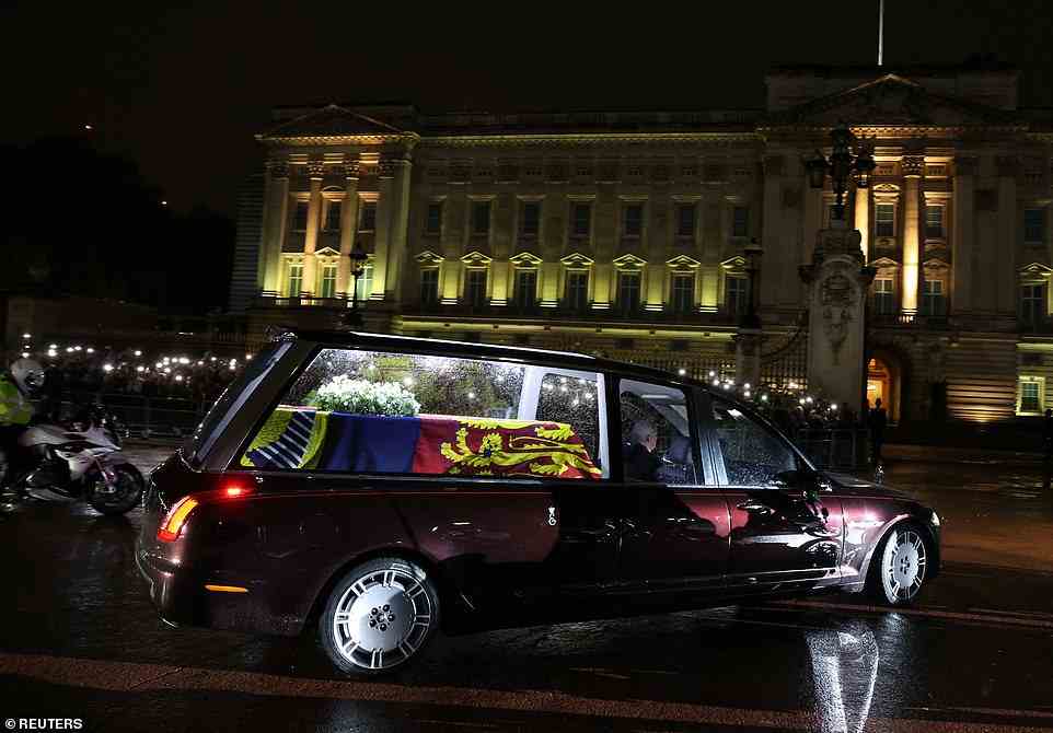 The hearse carrying the coffin of the late Queen arriving at Buckingham Palace