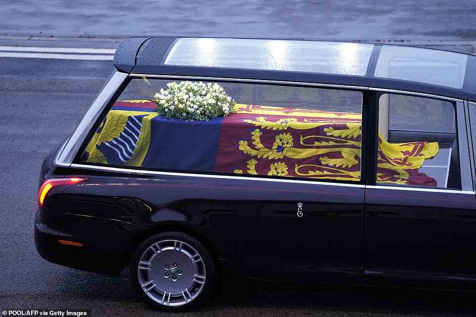 The coffin of Queen Elizabeth II is taken away in the Royal Hearse