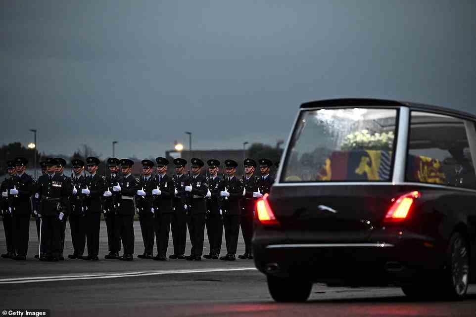 The Queen's Colour Squadron, RAF, stand by as the coffin of Queen Elizabeth II is taken away in the Royal Hearse