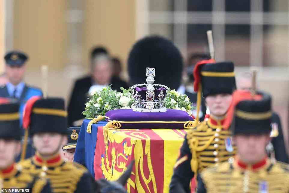 Her Majesty's coffin was adorned with a Royal Standard and the Imperial State Crown and pulled by a Gun Carriage of The King's Troop Royal Horse Artillery during the procession
