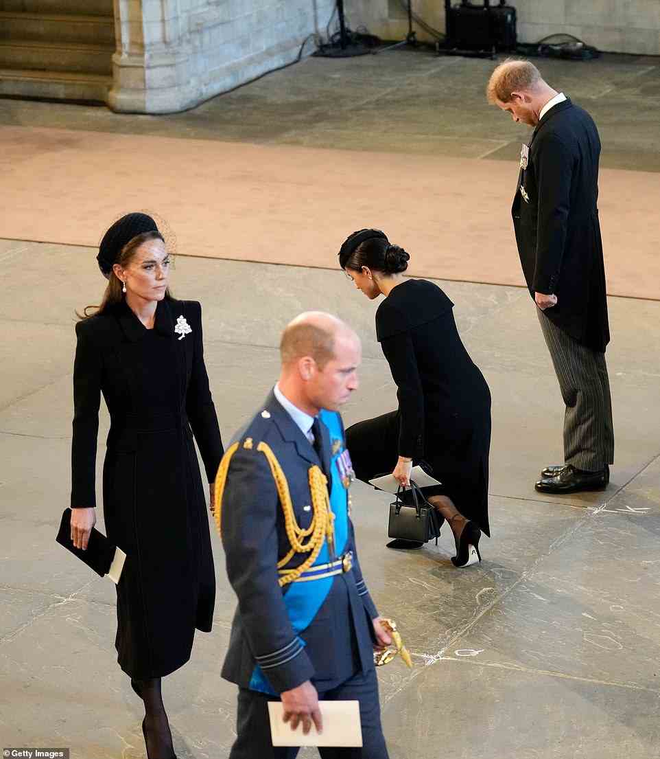 Meghan, Duchess of Sussex and Prince Harry, Duke of Sussex pay their respects in The Palace of Westminster