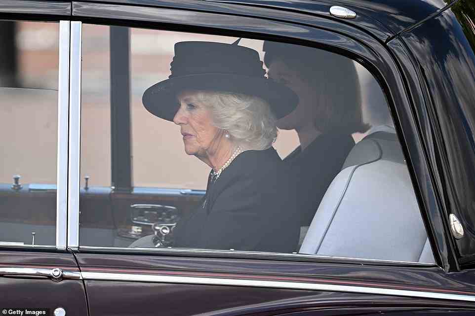 The Queen Consort, who was wearing pearl earrings and a pearl necklace, looked deep in thought as she arrived at the Palace today
