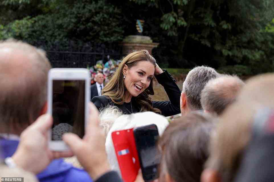 Royal fans scrambled to take photographs and record the historic moment as the new Princess of Wales greeted members of the public outside Sandringham Estate today