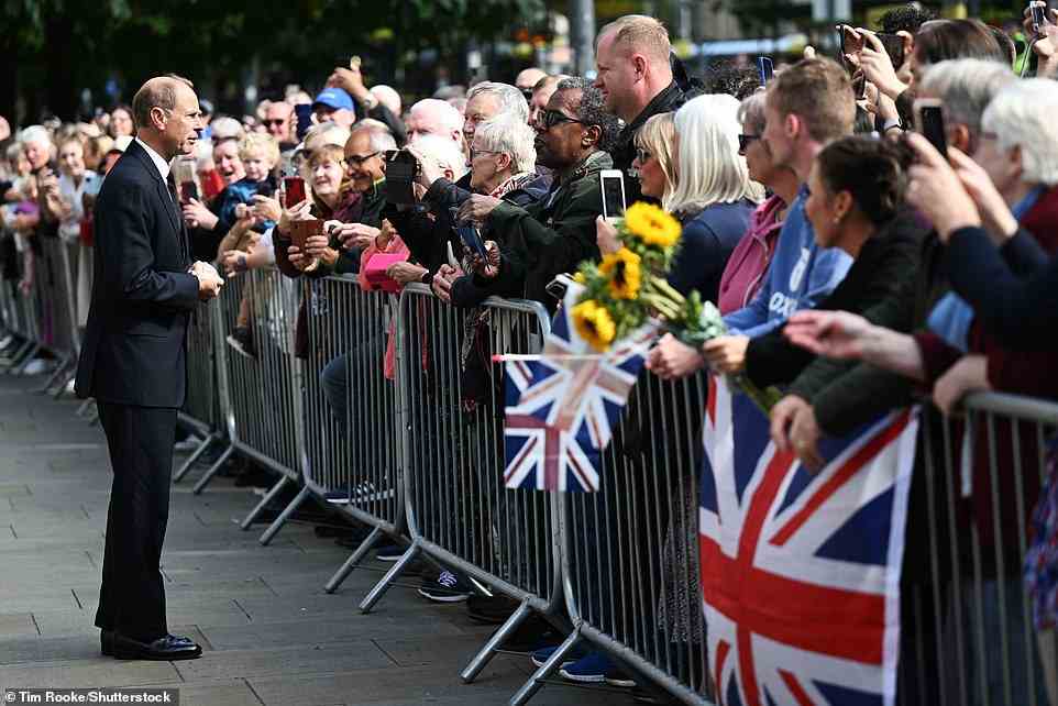 Prince Edward speaks to huge crowds of well-wishers as he and the Countess of Wessex make a visit to Manchester