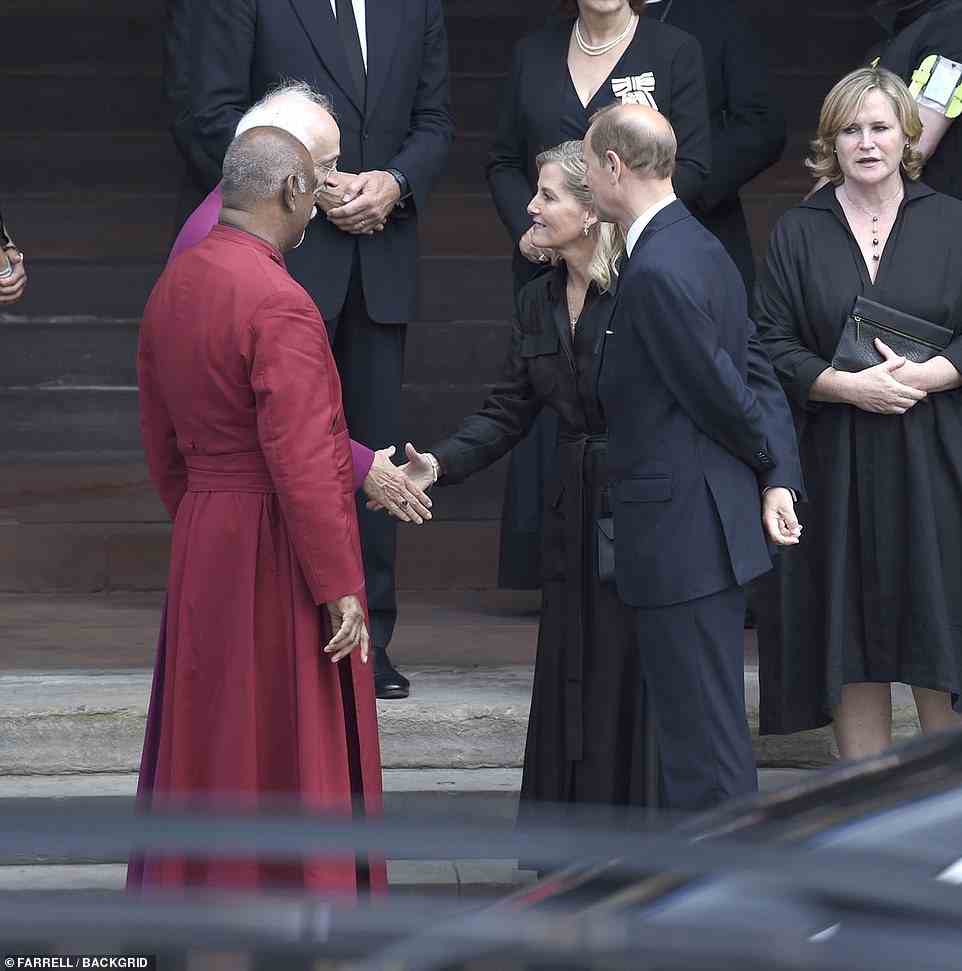 Prince Edward and his wife Sophie, the Countess of Wessex shake hands with clerics at Manchester Cathedral