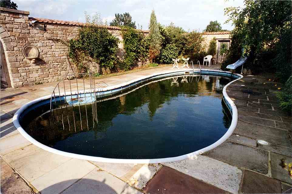 The property boasted this swimming pool before Camilla moved in, although, as a keen gardener, it is likely she has added her own personal touches