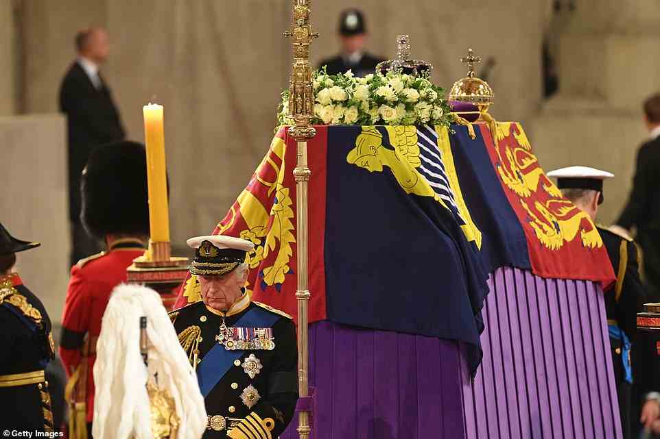 As tearful mourners watched on, the Queen's four children stood guard of their mother's coffin for more than 10 minutes at Westminster Hall this evening. The siblings each guarded a side of the coffin, with Charles, dressed in a Navy Admiral uniform, standing at the head