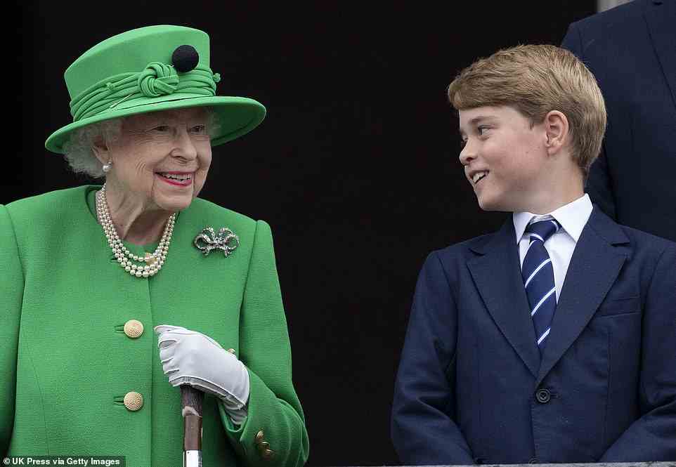 The pair share a smile together as they stand before the crowds at Buckingham Palace at the end of the Platinum Pageant on The Mall in June