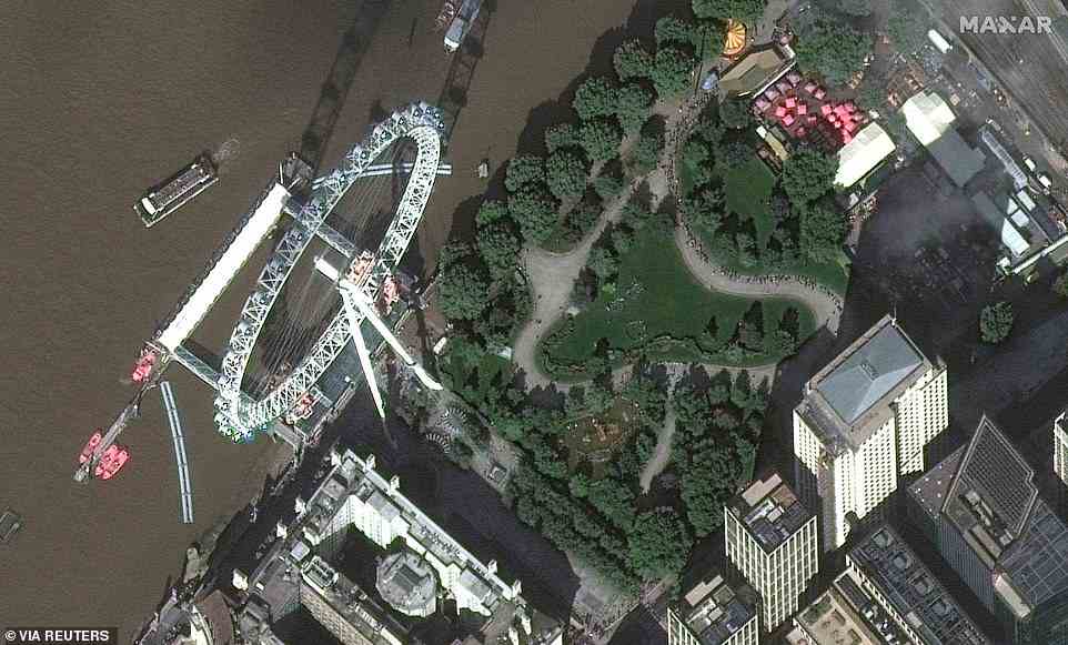 A satellite image shows queues of people in central London waiting to pay their respects