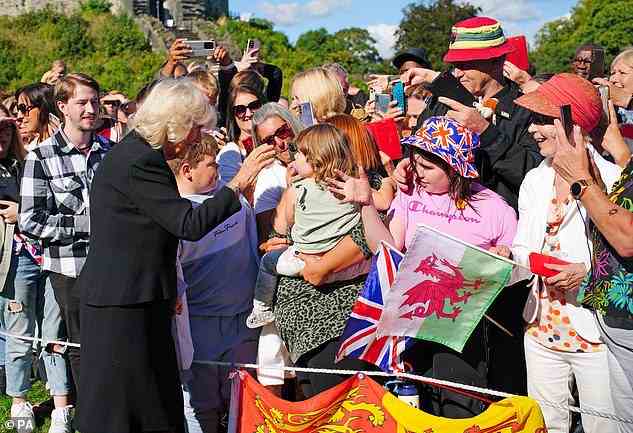 The Queen Consort meeting members of the public who cheered as she and the King did a walkabout as she and her husband left Cardiff Castle in Wales