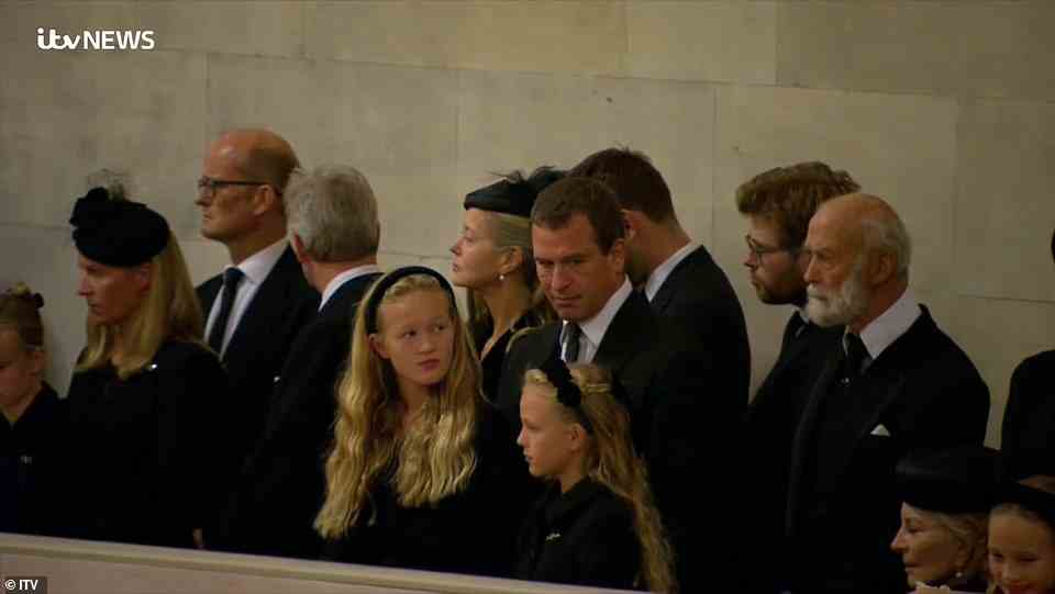 Peter Phillips pictured in the stands alongside his daughters Savannah Phillips and Isla Phillips