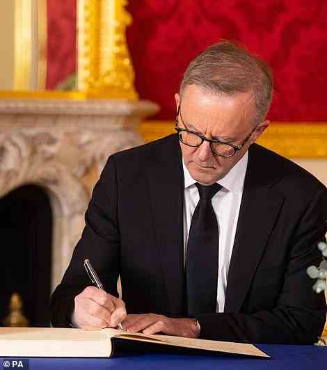 Pictured: Mr Albanese signing the book of condolence