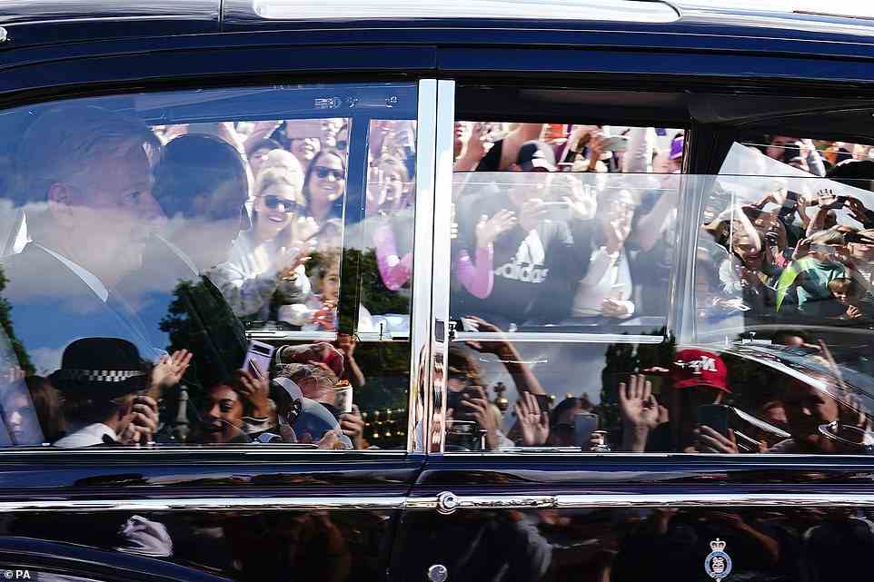 Well-wishers cheered and waved at the monarch as he was driven in the state Rolls-Royce to the palace