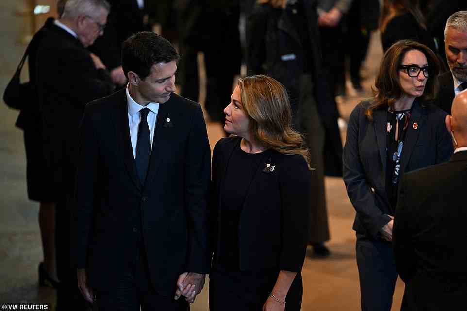 Canada's Prime Minister Justin Trudeau and his wife Sophie Trudeau pay respects to Britain's Queen Elizabeth in Westminster Hall