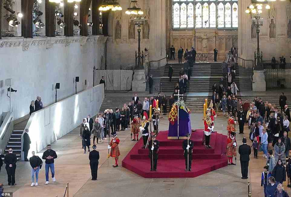The president was joined by his wife and the US Ambassador on the VIP balcony (pictured left) at Westminster Hall as he paid tribute to the late monarch