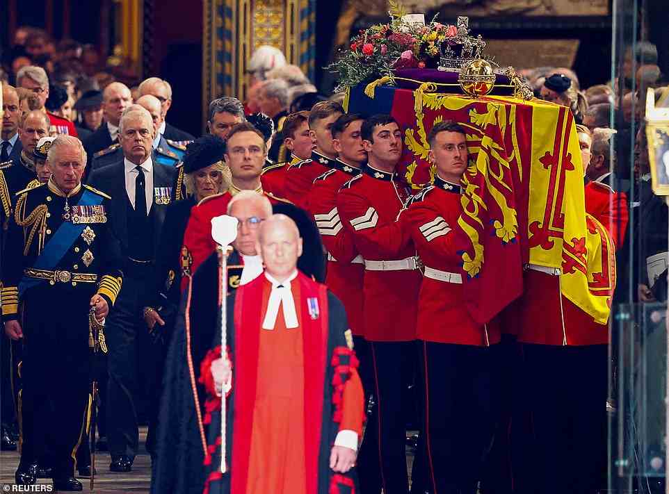Queen Consort Camilla walked by King Charles III's side as the emotional monarch walked behind his mother-s coffin out of Westminster Abbey