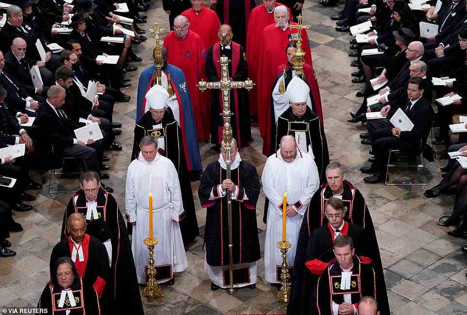 The congregation looked on as the Monarch's coffin was escorted out of Westminster Abbey following her state funeral today
