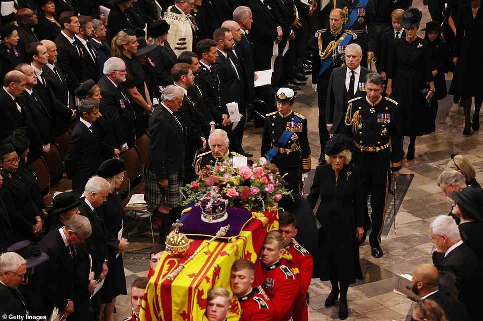 The congregation looked on respectfully as the Queen's children, led by King Charles III and the Queen Consort, followed the Queen's coffin into Westminster Abbey