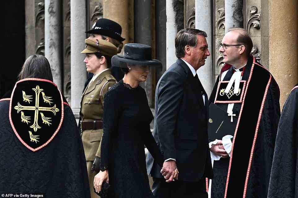 Brazil's President Jair Bolsonaro (right) and his wife Michelle Bolsonaro were also among the foreign heads of state invited to the service at Westminster Abbey this morning