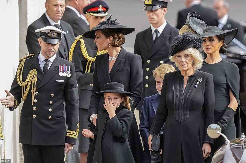 The Princess of Wales spoke to the Equerry of the Prince of Wales as they followed the coffin from the funeral earlier today