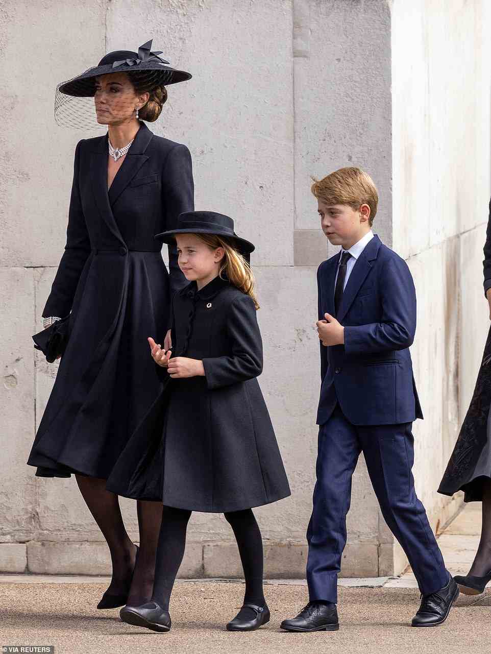 The Princess of Wales with her children Prince George and Princess Charlotte following the funeral service at Westminster Abbey
